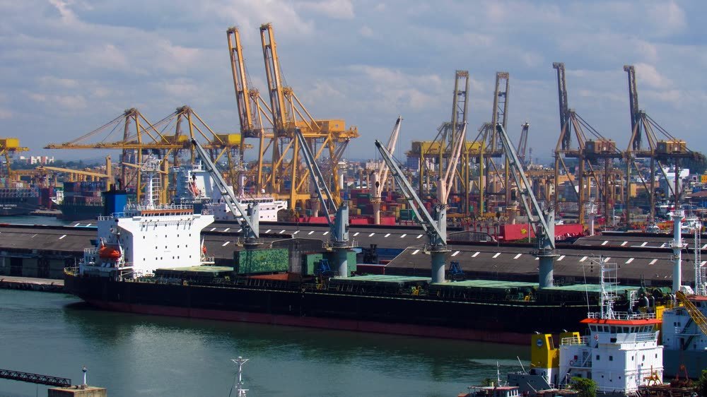 Gantry cranes and a cargo ship at the Port of Colombo.